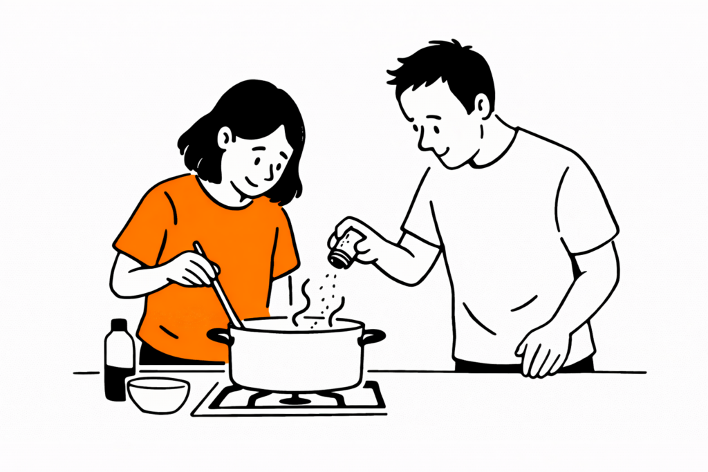 NDIS mentoring supporting a young adult to prepare a meal.