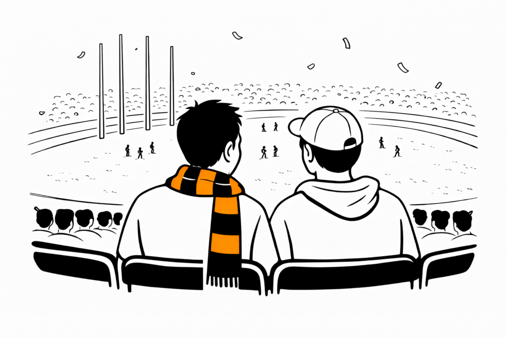 NDIS mentoring supporting a young adult at a footy game.